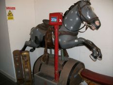 A large coin operated ride on horse in working order
