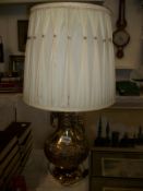 A large brass table lamp