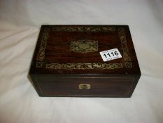 A rosewood jewellery box with brass inlay
