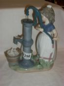 A Lladro figurine of a girl with pump
