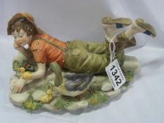 A porcelain boy with ducks signed Kulta