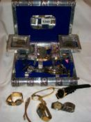 A jewellery box containing watches, coins etc