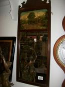 A mahogany framed mirror with hunting scene picture on top