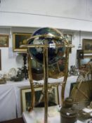 A jewelled floor standing globe with compass