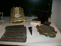 A brass letter rack, bakelite pipe rack, copper stencils etc