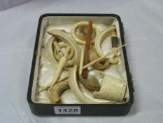 A box of bone and ivory items including Stanhope