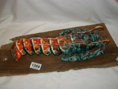 A Jersey pottery lobster on driftwood base