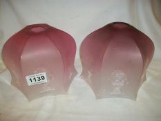A pair of etched cranberry glass lamp shades