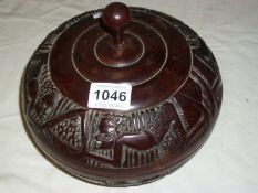 An African carved wood lidded bowl