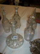 A cut glass ship's decanter and 4 others (including Victorian)