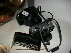 A Canon Av-1 camera and an Olympus OM10 camera
