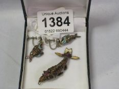 A superb quality articulated and enamelled fish pendant and earrings