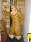 A large fairground clown figure (missing base)