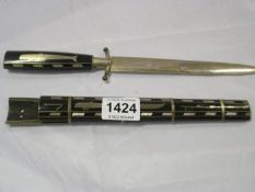 A late 19th century and scabbard with whaling depictions