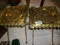 A pair of Victorian brass trivets