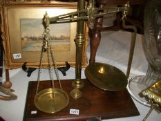 A set of Victorian brass beam scales on mahogany base