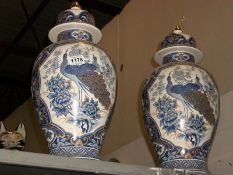A large pair of Oriental style lidded vases