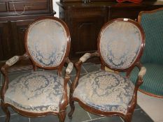 A pair of mahogany salon chairs