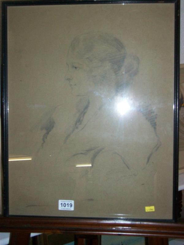 A pencil portrait of a lady marked Jud '73