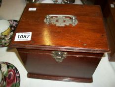 A mahogany box with metal fittings