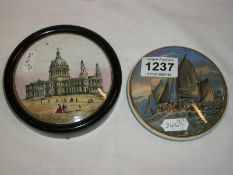 A pot lid depicting St Paul's Cathedral and one other