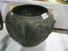 An old metal jardiniere (no bottom)