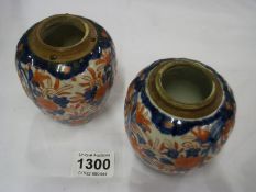 A pair of Imari ginger jars, missing lids