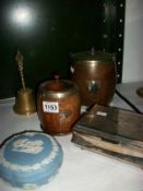 An oak biscuit barrel, oak tea caddy, and a silver plated box, brass bell and Wedgwood bowl