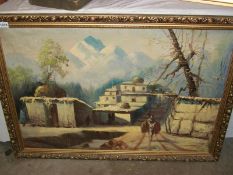 A gilt framed Middle Eastern village scene (oil on board)