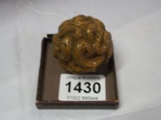 A carved snake ball