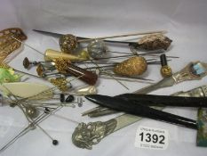 A collection of hat pins etc