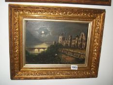 A gilt framed night scene