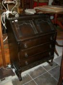 A dark oak bureau