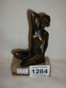 An Art Deco spelter figure of a nude woman