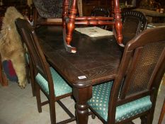 A good quality oak dining table and 6 chairs
