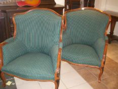 A pair of mahogany framed arm chairs