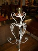 A wrought iron half size standard oil lamp