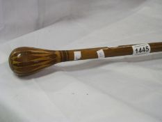 A mixed wood walking stick