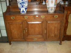 An oak arts and crafts style sideboard