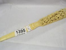 A carved bone/ivory page turner