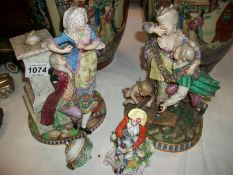 A pair of Continental porcelain figures, a/f, and one other