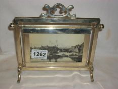 An unusual photo frame with 2 photographs of Lincoln