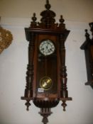 A Victorian mahogany wall clock