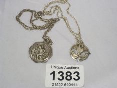 A silver St. Christopher and a silver pendant
