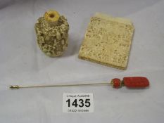 A perfume bottle, hat pin and part card case (possibly ivory)