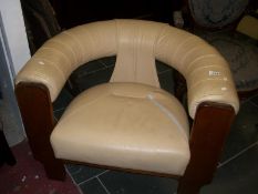 A cream leather retro tub chair (leather a/f)