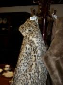 A faux leopard fur coat