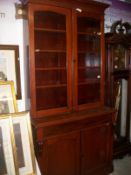 A Victorian 2 door glazed top mahogany bookcase