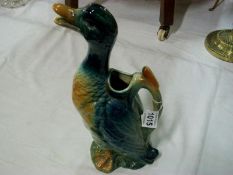 A French pottery jug in the shape of a duck