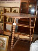 An oak bobbin leg table